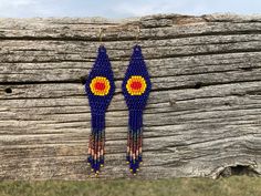 Statement earrings for powerful womxn. Send your climbs, summit your peaks, and take up your unique space in the outdoors. These stunning, hand stitched beaded earrings in a Southwestern theme will empower you on your next adventure and wherever you go. These dangle earrings have both sophistication and the "wow" factor. The color scheme is inspired by fiery sunsets of the southwest. Ear wires are gold-plated, silver, or copper. Please specify the type of metal you would like when ordering. All Blue Hand-strung Dangle Beaded Earrings, Blue Southwestern Beaded Fringe Earrings, Southwestern Blue Beaded Fringe Earrings, Artisan Long Drop Beaded Earrings, Handmade Southwestern Blue Beaded Earrings, Artisan Beaded Earrings For Festivals, Blue Hand-strung Beaded Earrings, Southwestern Handwoven Blue Jewelry, Southwest Chic