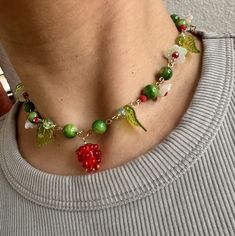 One of a kind fun flowery fruit necklace. 15inches long Trendy Flower Shaped Beaded Necklaces As Gift, Trendy Flower Beaded Necklaces As Gifts, Trendy Green Jewelry With Fruit Design, Casual Flower-shaped Beaded Necklace As Gift, Colorful Beaded Flower Pendant Necklace As Gift, Flower Pendant Necklace With Colorful Beads As Gift, Trendy Handmade Flower Necklace For Gift, Trendy Flower Choker Necklace (gift), Trendy Flower Choker Necklace Gift