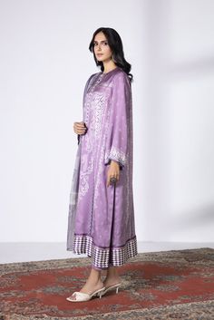 Immerse yourself in soft hues with this intricately patterned lilac fantasy in satin paired with a chiffon dupatta. Product DetailUnstitched 3-Piece SHIRTDigital Printed Blended Satin Shirt 2.3MFabric: Blended SatinColour: Lilac DUPATTADigital Printed Blended Chiffon Dupatta 2.5MFabric: Blended ChiffonColour: Multi TROUSERDyed Blended Raw Silk Trouser 2.5MFabric: Blended Raw SilkColour: Lilac Elegant Purple Palazzo Set With Dupatta, Purple Silk Sets For Formal Occasions, Formal Purple Sets With Dupatta, Formal Purple Salwar Kameez With Resham Embroidery, Formal Purple Unstitched Suit, Elegant Purple Straight Kurta Set, Elegant Purple Long Sleeve Palazzo Set, Elegant Long Sleeve Purple Palazzo Set, Elegant Purple Dupatta For Eid