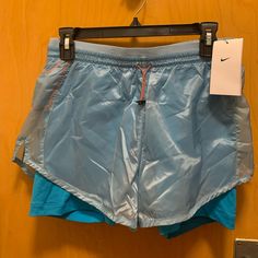 Never Worn Nike Blue Running Shorts Lined. Drawstring Adjustment. Pocket On The Back. Light Blue Nylon Bottoms For Summer, Nike Nylon Beach Bottoms, Blue Nylon Workout Bottoms, Nike Blue Nylon Bottoms, Blue Nike Athletic Shorts With Elastic Waistband, Blue Summer Activewear With Pockets, Nike Sports Bottoms In Light Blue, Nike Light Blue Sports Bottoms, Light Blue Casual Bottoms For Gym