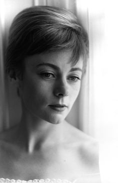 a black and white photo of a woman with short hair