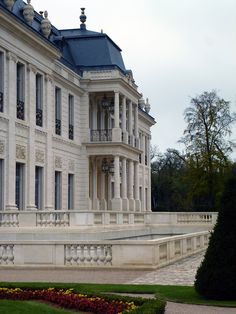 a large white building with many windows and balconies