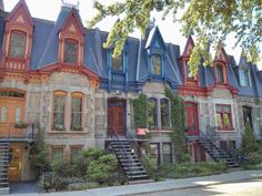 row houses with different colored windows and balconies