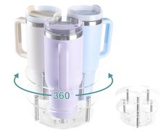 three coffee mugs sitting on top of a glass holder with the numbers 360 below them