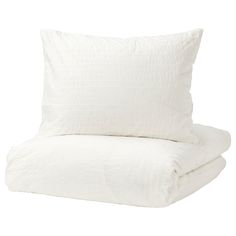 two white pillows stacked on top of each other