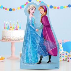 there is a birthday card with an image of two princesses on it and candles in the background