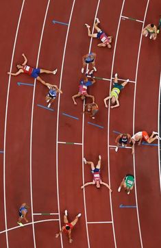 several athletes are competing in a track race