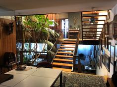 a living room filled with furniture and stairs