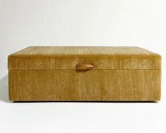 a large brown box sitting on top of a white floor