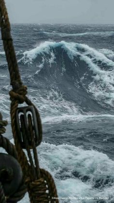 a boat in the ocean with large waves