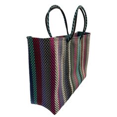 Oaxaca tote Bag, Handmade Mexican Bag, Getaways bag, Travel Bag, Basket, Beach Bag,vegan bag ,Plastic Woven, Oaxaca Bag, recycled plasticThe specifics are impressive: the bag is woven from a heavy duty, pliable plastic that is near indestructible. The weave is so tight, the bag is waterproof, which alone makes it uniqueApproximate measurements.13.5 h x 17 w x 5.5 d34 x 43 cmPlease note, since this piece is made by hand there may be some imperfections. Instead of viewing this as a mistake, let it Multicolor Bags Made Of Recycled Materials For Everyday Use, Multicolor Recycled Material Bags For Everyday Use, Recyclable Tote Beach Bag, Reusable Tote Bag Made Of Recycled Materials, Everyday Multicolor Bags Made From Recycled Materials, Reusable Tote Bags Made From Recycled Materials, Reusable Rectangular Bags Made Of Recycled Materials, Recyclable Rectangular Beach Bag For Shopping, Daily Use Multicolor Bags From Recycled Materials