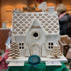 a gingerbread house is on display in a store