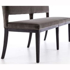 an upholstered bench with wooden legs