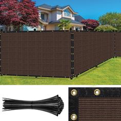 a brown privacy fence with two black poles and some grass in front of the house