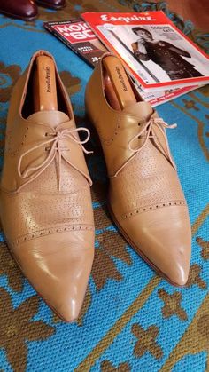 What a stunning pair of early 60s mod gems. Made by Super Modell circa 63. These are a Euro 42 which is a uk 7.5 to 8. Makers mark still visible on the inside,with light wear. A couple of light scuffs and creases to leather only which polish will just enrich.  The heel of right shoe shows a tiny split to leather,please see pics. These originals really don't pop up that often and they go for good money,I have 3 pairs listed which I acquired from the same 60s original Mod. For lovers of the original mod jazz scene these are a must. Perfect for period film TV etc.  My Generation Vintage on FB and Instagram Fitted Vintage Leather Shoes With Leather Sole, Vintage Leather Shoes With Round Toe, Retro Plain Toe Leather Shoes, Vintage Fitted Leather Shoes For Formal Events, Vintage Leather Shoes With Brogue Detailing And Almond Toe, Vintage Leather Brogue Shoes With Almond Toe, Retro Leather Shoes With Round Toe For Formal Occasions, Retro Formal Leather Shoes With Round Toe, Vintage Almond Toe Leather Shoes For Formal Occasions