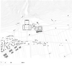 the site plan is outlined in black and white, with several buildings on each side