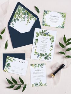 wedding stationery with greenery and navy blue envelopes