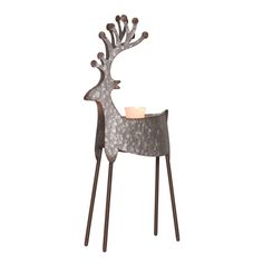 a metal deer table with a candle on it