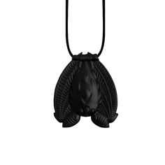 a black necklace with an animal head on it