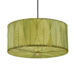 a green lamp shade hanging from a ceiling fixture with leaves on the top and bottom