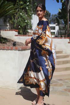 Beautiful navy and white designer print silk caftan. I'ts elegance will take you to any occasion.  One size.  Fits small to extra large sizes.  The width is 52 inches, edge to edge, 104 around the body.  The side seams are 6 inches from the edge.  The length is 50 inches.  Machine was on a delicate cycle for short time., Elegant Printed Maxi Dress For Vacation, Elegant Flowy Kaftan For Vacation, Elegant Silk Kaftan For Vacation, Elegant Printed Beach Kaftan, Elegant White Beach Kaftan, Elegant Maxi Dress With Kimono Sleeves For Vacation, Elegant Printed Silk Kaftan, Elegant Silk Printed Kaftan, Elegant Beach Kaftan With Kimono Sleeves