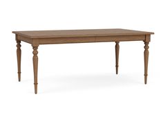 a wooden table sitting on top of a white floor