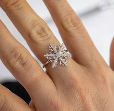 Welcome winter with our whimsical holiday snowflake ring, Crystal. It features 100% simulated diamond material (AAA CZ) stones on each of the 6 arms, adding sparkle to your whole look. It is about 3/4" in size. The intricate design of the certified 925 sterling silver band is plated in rhodium.  Buy this intricate ring design for the holidays and enjoy a festive and fun look, that can carry on throughout the winter season! Snowflake Engagement Rings, Descendants Accessories, Snowflake Ring Engagement, Christmas Engagement Proposal, Snowflake Rings, Rings Snowflake, Dr Accessories, Snowflake Engagement Ring, Engagement Proposals