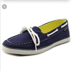 a blue boat shoe with white laces on the top and bottom, in front of a white background