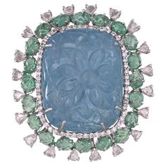 A very gorgeous and beautiful, one of a kind, moderns style, Aquamarine & Emerald Cocktail Ring set in 18K White Gold & natural Diamonds. The weight of the carved Aquamarine is 63.97 carats. The Aquamarines are hand carved in our very own workshop. The weight of the carved Emeralds is 3.78 carats. The Emeralds are completely natural, without any treatment and are of Zambian origin. The combined Diamonds weight is 2.11 carats. Net 18K Gold weight is 13.50 grams. The gross weight of the Ring is 27.47 grams. The dimensions of the Ring are 4.00cm x 3.50cm x 2.00cm (L x W x D). The Ring is made in US Size 6.5 and can be changed on request. ✦ Handmade / Handcrafted Fine Jewelry ✦ Gemstone: carved Aquamarine ✦ Gemstone Cut: Carved cushion ✦ Gemstone Weight: 63.97ct. Approx. ✦ Gemstone: natural Za Emerald Cocktail Ring, Emerald Cocktail, Diamond Cocktail Rings, Aquamarine Gemstone, Jewelry Gemstone, Emerald Gemstone, Beautiful One, Emerald Diamond, Diamond Clarity