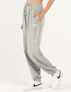 NIKE Sportswear Club Womens Oversized Fleece Sweatpants - HEATHER GRAY | Tillys Sportswear Sweatpants With Elastic Cuffs, Sportswear Sweatpants With Elastic Waistband For Fall, Fall Season Sportswear Sweatpants, Fall Sweatpants With Elastic Waistband, Nike Sweatpants For Sports, Nike Relaxed Fit Sweats With Elastic Waistband, Nike Sweatpants With Ribbed Waistband For Jogging, Nike Moisture-wicking Sweatpants, Nike Sweats With Elastic Waistband For Loungewear