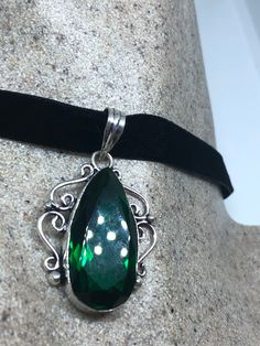 Handmade Vintage Green Glass  Crystal Choker Pendant
https://www.etsy.com/listing/644272871/handmade-vintage-green-glass-crystal Green Oval Jeweled Jewelry, Green Sterling Silver Jewelry With Jewels, Sterling Silver Green Jewelry With Jewels, Ornate Green Jewelry With Jewels, Silver Emerald Pendant Necklace As Gift, Formal Teardrop Emerald Jewelry, Elegant Engraved Emerald Jewelry, Antique Emerald Jewelry For Formal Occasions, Elegant Green Jewelry With Large Pendant