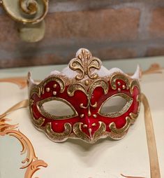 Original Venetian mask handmade in carâché and hand painted in acrylic colors and gold/silver leaf.Beautiful to wear on some particular occasion but also as a decoration of the house.All our masks are handmade by our staff (me, my wife and our collaborators) in our atelier in Venice. The masks are all made of paperweight and are made using ancient techniques from the 1300sThey are decorated with acrylic colors, gold leaf, silver leaf, trifies, lace and Swarovski crystals so as to make them more Red Masquerade Mask, Glitter Mask, Beautiful Masks, Gold Masquerade Mask, Mask Carnival, Masque Halloween, Venice Mask, Ancient Techniques, Venetian Masquerade Masks