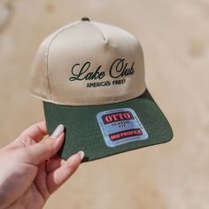 It's the summer's favorite club - the Lake Club! Take our design and sport it out on the water for that extra layer of SPF. We love this cursive script and the color matching thread to the bill. The antique white is super crisp! This is the first of this kind of hat, so we can't wait to see how you style it. Tag us on Instagram! @AgencyofSaints Hat Band - 22 ⅘ (adjustable) Crown Height - 4 ¾ Summer Sports Trucker Hat With Embroidered Logo, Outdoor Summer Snapback Hat With Letter Print, Summer Outdoor Snapback Hat With Letter Print, Summer Snapback Hat For Sports Events With Flat Brim, Summer Outdoor Letter Print Snapback Hat, Summer 5-panel Snapback Hat With Embroidered Logo, Summer Sports Snapback Hat With Flat Brim, Summer Embroidered Logo 5-panel Snapback Hat, Summer Sports Baseball Cap With Flat Brim