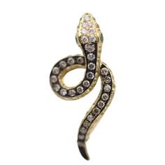 A sleek and stylish snake set with diamonds, sapphires and tsavorites! A small pin that can be worn easily on any outfit. It features 0.35 carats of round brilliant-cut diamonds along with 0.68 carats of yellow sapphires and two tsavorite eyes. The pendant is made in 18k yellow gold and has rhodium plating running down the snake giving the piece great contrast of color. Length: 1 inch Weight: 3.4 grams Snake Pendant, Small Pin, Snake Ring, Gold Snake, The Snake, Diamond Gold, Yellow Sapphire, Round Brilliant Cut Diamond, Round Brilliant