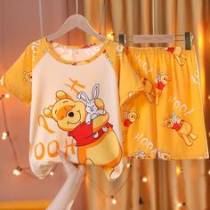 The Cartoon Pajamas Set: Top & Pants is the perfect combination of comfort and style for your little ones.Crafted with high-quality, soft fabric, these pajamas are perfect for warm summer nights. Featuring a cute cartoon bear design, they are suitable for both boys and girls, making them a versatile addition to your child's wardrobe.The set includes a short-sleeved t-shirt and matching pants, providing your child with a comfortable and breathable sleepwear option. The elastic waistband ensures a Cotton Cartoon Print Sleepwear For Pajama Party, Cartoon Print Cotton Sleepwear For Summer, Cartoon Print Bedtime Sets For Summer, Summer Bedtime Sets With Cartoon Print, Summer Loungewear Sets With Cartoon Print, Summer Cartoon Print Sleepwear For Sleepover, Kawaii Summer Sleepwear, Kawaii Summer Sleepwear For Loungewear, Summer Sleepover Sleepwear With Cartoon Print