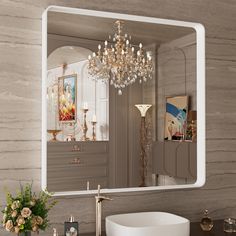 a bathroom with a sink, mirror and chandelier in front of the wall