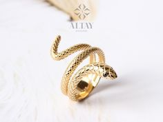 ABOUT PRODUCT This 14K Gold Snake Ring is suitable gift for girlfriend, mom and her. You can even buy as a birthday gift for your friends or anniversary gifts, If you want to add a special note we can write for you and put to inside of package. We manufacture our jewelry pieces with carefully and after production we double checking in quality control department. Our main idea is keep our items for daily wearing especially for minimalist jewelry pieces. 14K Gold Snake Ring, Wrap Snake Band, Daint Symbolic Adjustable Snake Ring Gift, Adjustable Symbolic Snake Ring Gift, Adjustable Snake Ring Fine Jewelry For Gift, Elegant Snake Shape Ring As Gift, Elegant Snake Shape Ring For Gift, Elegant Snake Shape Ring Gift, Handmade Snake Open Ring As A Gift, Handmade Open Snake Ring As Gift, Handmade Open Snake Ring For Gift