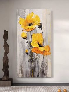 yellow flowers are painted on a white wall