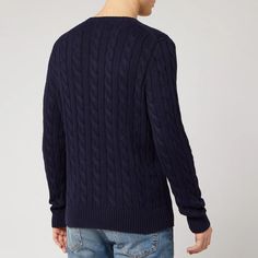 This Polo Ralph Lauren navy cable knit jumper boasts an embroidered polo logo on the chest. Crafted from a thick cotton yarn, it is completed with ribbed trims on the neck, cuffs, and hem. Winter Cotton Cable Knit Polo Sweater, Navy Cotton Cable Knit Sweater, Ralph Lauren Casual Cable Knit Sweater, Casual Ralph Lauren Cable Knit Sweater, Ralph Lauren Classic Cable Knit Sweater, Classic Cotton Cable Knit Polo Sweater, Ralph Lauren Cable Knit, 1/4 Zip Sweater, Polo Logo