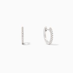 Elevate your small Sterling Silver or gold hoop earrings with some pavé details. Our Tiny Huggies not only add some extra shine to your ear stack, but they also make the perfect everyday layering piece. If you prefer a minimal look, pair these huggie earrings with our Simple Stud Earrings. For a statement stack, pair t White Gold Stackable Huggie Hoop Earrings, Minimalist Hoop Earrings With Pave Setting, Everyday White Gold Hoop Earrings With Pave Setting, Minimalist Everyday Hoop Earrings With Pave Setting, Minimalist Everyday Hoop Earrings With Pavé Setting, Minimalist Pave Setting Hoop Earrings For Everyday, Everyday Small Hoop Diamond Earrings, Everyday Pave Setting Huggie Hoop Earrings, Classic Everyday Huggie Earrings With Pave Setting