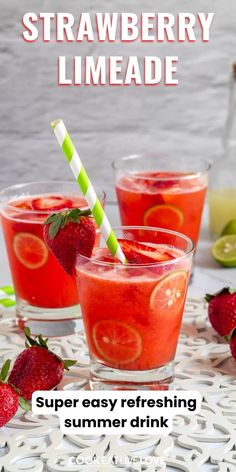 two glasses filled with strawberry limeade on top of a table