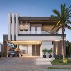 a car is parked in front of a modern house with palm trees on the driveway