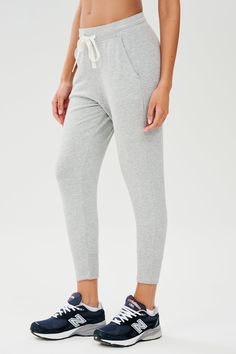 Our best-selling classic cropped sweatpant in ultra luxe fleece, Reena will become your go to piece for every day wear. Pair it with the Warm Up Fleece Pullover and enjoy effortless fit and pure comfort. BEST FOR: Chilling out after running, yoga, CrossFit, barre, Pilates, cycling and spin class. Model is 5'10" and wears a size small. Athleisure Ankle-length Joggers With Elastic Side Panels, Athleisure Sweatpants With Ribbed Waistband For Lounging, Sporty Relaxed Fit Pants For Loungewear, Athleisure Pants With Comfort Waistband For Loungewear, Relaxed Fit Athleisure Pants For Lounging, Athleisure Pants For Lounging, Athleisure Pants With Elastic Waistband For Lounging, Solid Ankle-length Athleisure Joggers, Athleisure Joggers With Elastic Waistband For Loungewear