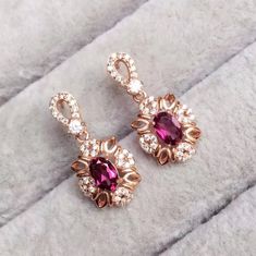 Welcome to Elegant Art Jewelry!  Stone: Natural Red Garnet Stone Size: ( Pendent: 6mm×8mm ), ( Ring: 6mm*8mm ), ( Earrings: 7mm*5mm ) Side Stone: Zircon Metal: 925 Sterling Silver Personalization: 9K/14K/24K/GOLD/SILVER/PLATINUM/ROSE-GOLD/WHITE GOLD. (Contact me)  Red Garnet Pendant, Red Garnet Cuff Pendant, 925 Sterling Silver Pendant, Oval Shape Pendant, Red Garnet Pendant, Red Garnet Engagement, Open Design Pendant, Red Garnet Oval, Emerald Red Garnet, Red Garnet, Red Gemstone, Gemstone Penda Oval Red Garnet Jewelry, Garnet Jewelry Set, Red Garnet Jewelry, Red Garnet Necklace, Necklace Luxury, Platinum Rose Gold, Garnet Red, Garnet Pendant, Garnet Necklace