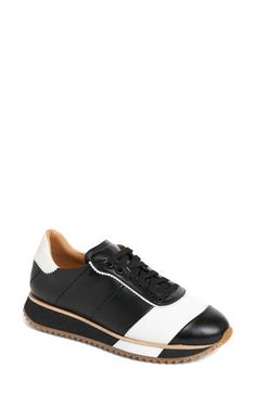 Pinking trim and a contrasting stripe put a polished spin on this essential lace-up sneaker. Removable insole Leather upper/leather and synthetic lining/rubber sole Imported Sporty Calf Leather Sneakers With Laces, Leather Lace-up Golf Shoes With Contrast Sole, Sporty Leather Golf Shoes With Contrast Sole, Wingtip Sneakers With Contrast Sole In Calf Leather, Black Sneakers With Stitched Sole For Sports, Black Sports Sneakers With Stitched Sole, Sporty Wingtip Sneakers With Laces, Black Lace-up Golf Shoes With Rubber Sole, Black Sporty Custom Sneakers With Stitched Sole