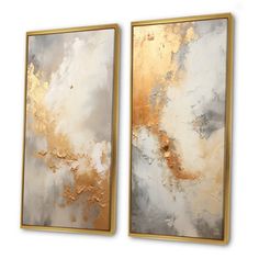 two gold and white paintings hanging on a wall