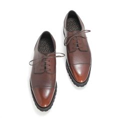 The Frank Cap Toe Derby in a handmade Chestnut patina is now available as a made-to-order shoe. To place your order with a 50% deposit, please use the code MTODEPOSIT during checkout. The balance will be collected before shipping your shoes. Reno grain calf leather Handmade chestnut patina Asymmetric design with no center back seam Bench made, Goodyear-welted construction Vibram Gumlite Commando Sole Quilted and padded insole Professionally hand finished before shipment Proudly made in Spain The Brown Cap Toe Derby With Goodyear Welt, Brown Cap Toe Derby With Goodyear Welted, Cognac Cap Toe Oxfords For Derby, Brown Goodyear Welted Cap Toe Dress Shoes, Brown Italian Oxfords For Work, Brown Goodyear Welted Cap Toe Leather Shoes, Brown Cap Toe Oxfords With Rubber Heel, Brown Dress Shoes With Rubber Heel Cap For Derby, Brown Cap Toe Oxfords For Derby