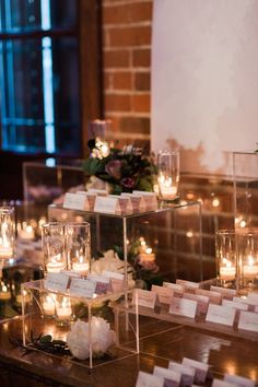 a table with candles and place cards on it