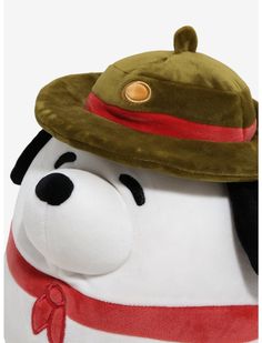 a stuffed dog wearing a hat and scarf