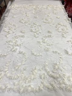 a white table cloth with flowers on it